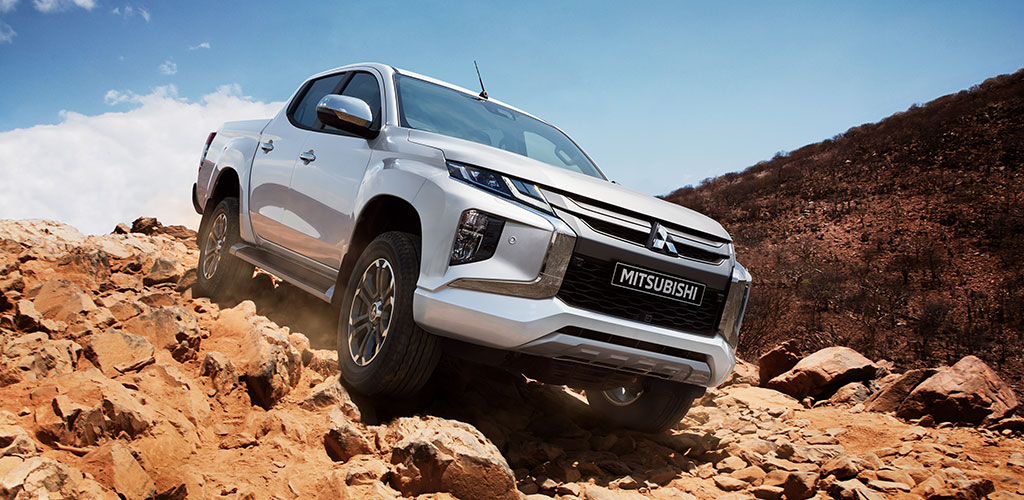 L200 driving mountain rocks